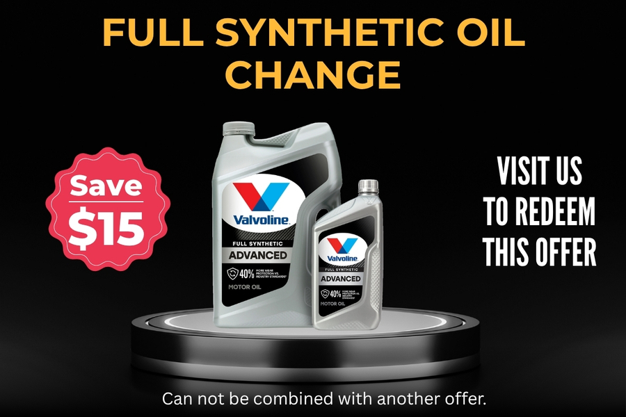 Two Valvoline full synthetic motor oil containers on a pedestal with 'Full Synthetic Oil Change' and a $15 savings badge on the left.